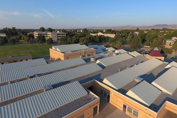 flat roof with slanted vents installed by our roofers in colorado