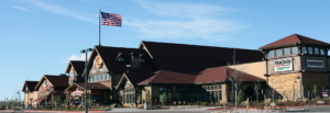 Bass pro shop building with an American flag flying overhead