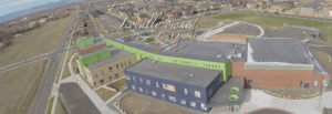 An overhead view of a blue, green, and tan building with "Locally Owned & Operated" text.