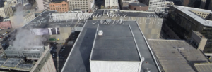 An overhead view of large building with "Quality Service Since 1947" text.