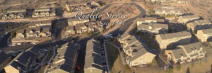 An overhead view of a housing development with "Quality Service Since 1947" text.