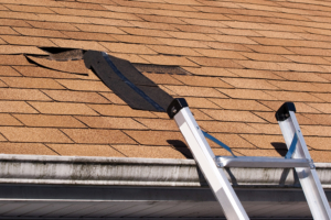 a tan colored roof with some damage showing